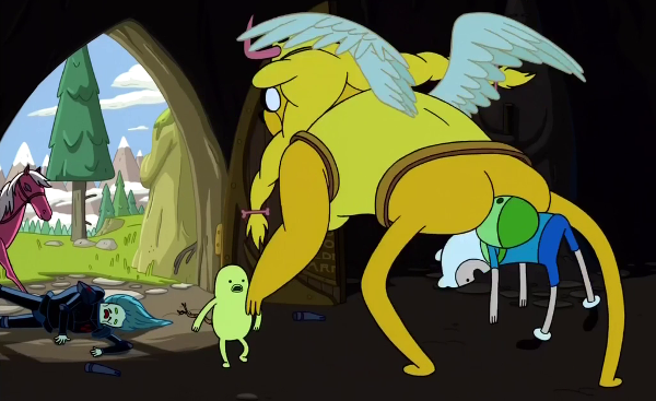 Jake, dressed in 'valkyrie' armour including a blonde wig and large boobs, picks up Finn between his buttocks. Sir Slicer, a green guy in angular black armour with very narrow eyes and a small moustache, lies collapsed on the ground. Sir Slicer's pink horse backs away in the background.