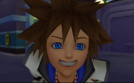 Sora leaning into the camera with his teeth bared in a sort of rictius grin.